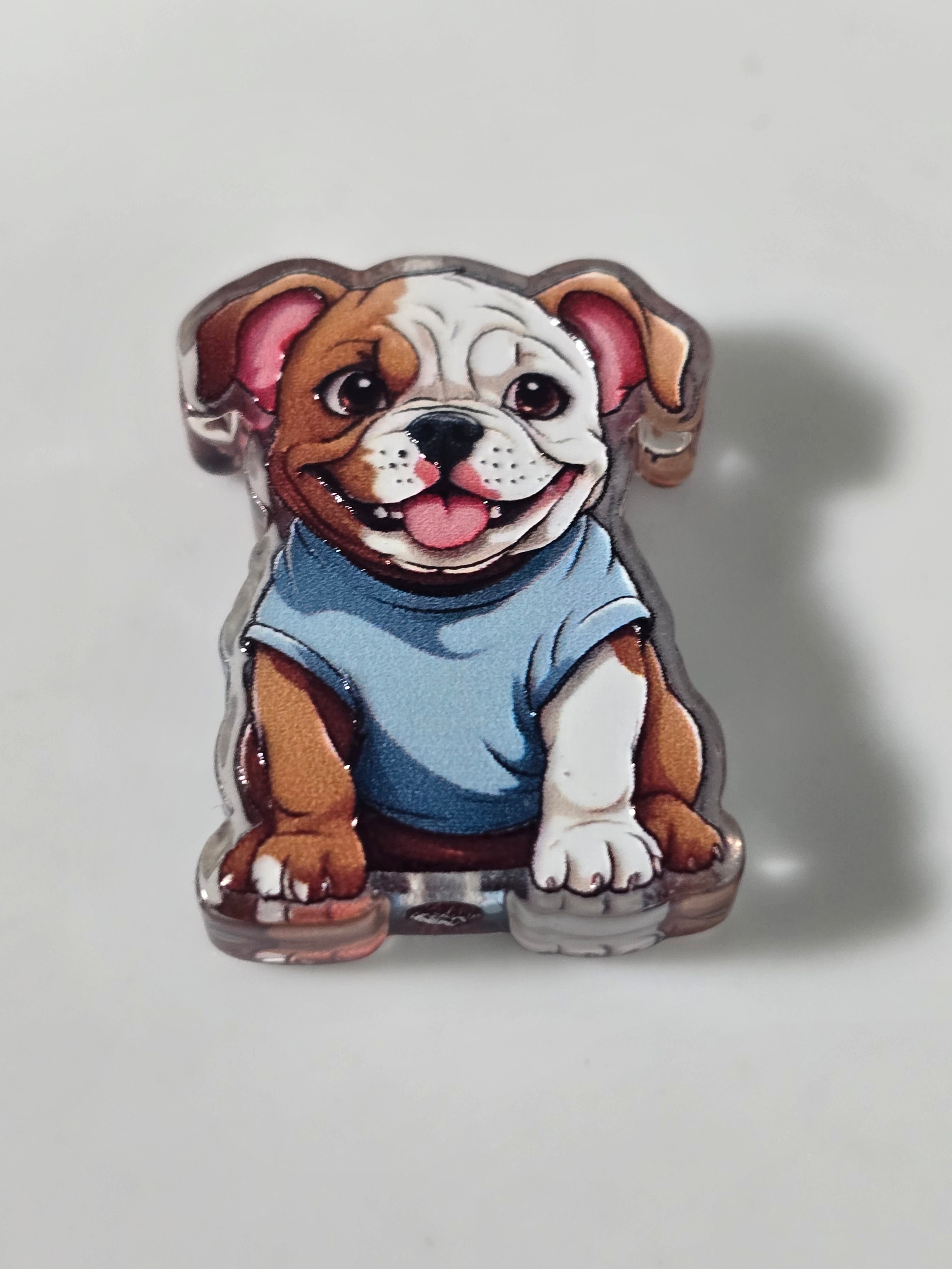 Stylized illustration of a bulldog wearing a blue shirt on a light gray background