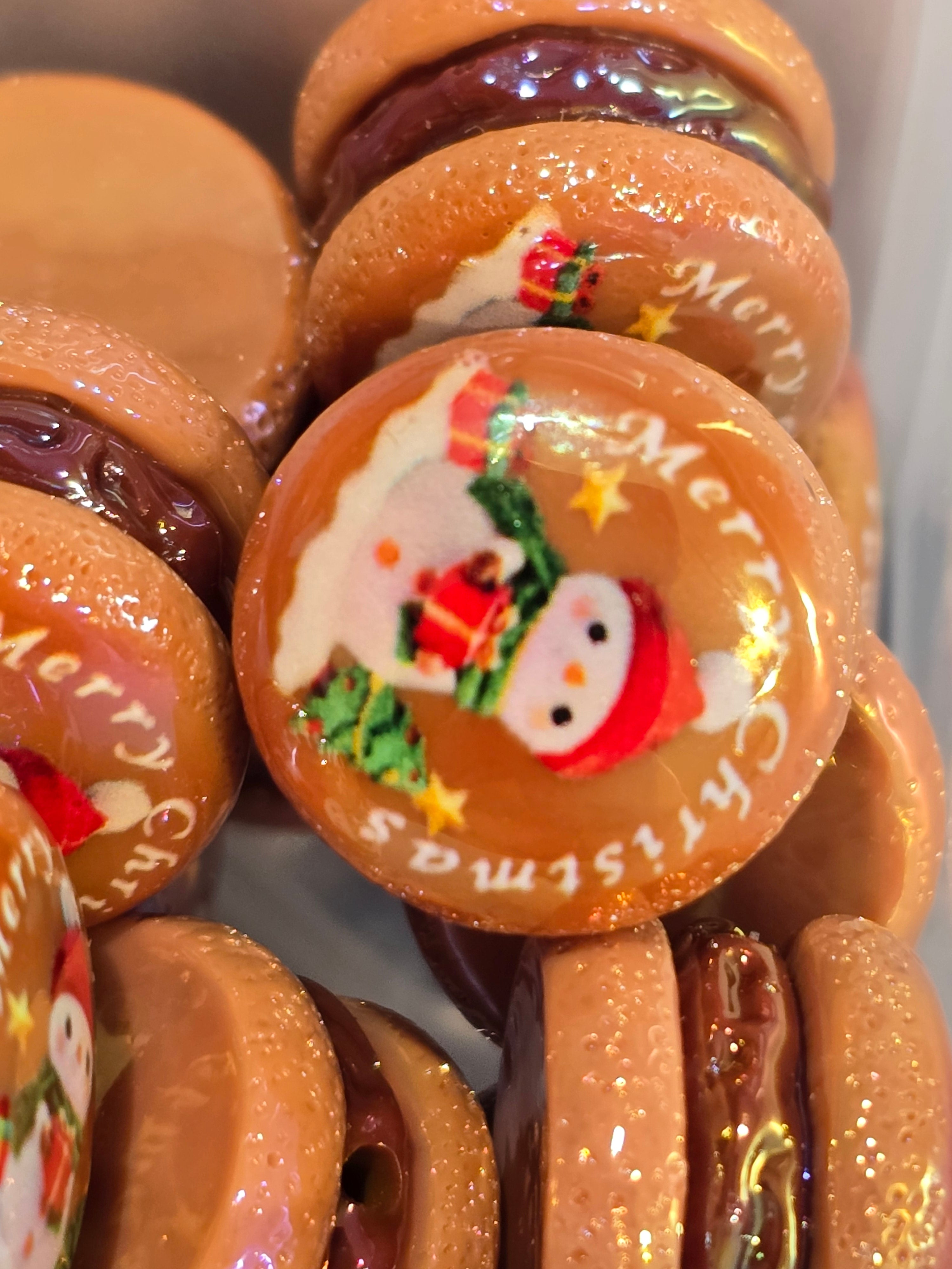 "Gold glitter resin Christmas cookie bead with snowman and Merry Christmas text design"