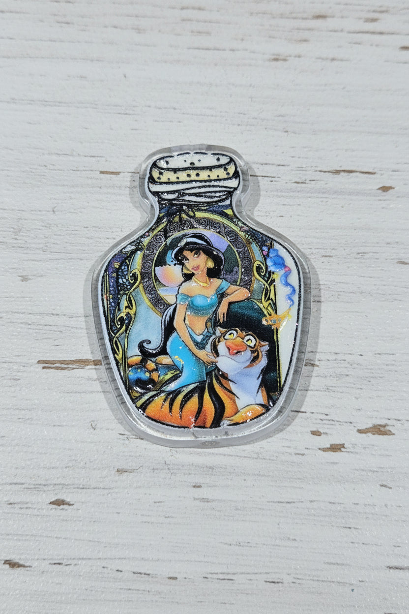 A small decorative bottle-shaped charm or pendant with a colorful illustrated scene of a woman and tiger.