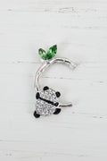 metal bamboo design bead with a panda hanging from it 