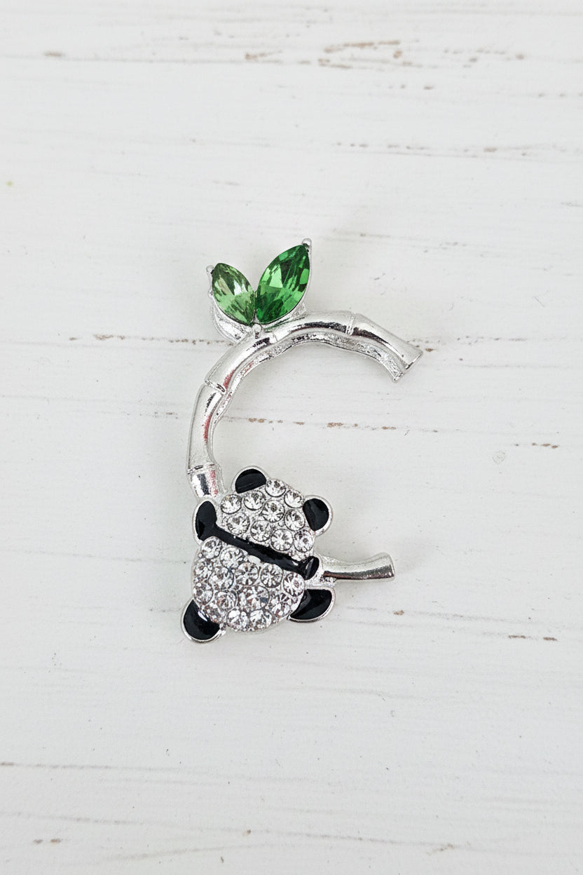 metal bamboo design bead with a panda hanging from it 