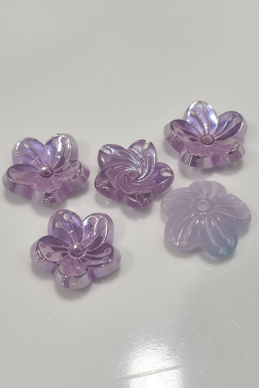 Five translucent lavender flower-shaped beads with a glossy finish.