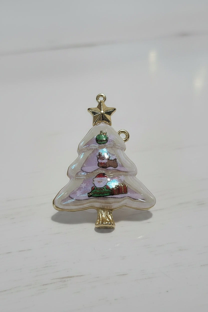 A Christmas tree-shaped clear resin pendant with gold trim, featuring Santa Claus, a reindeer, snow, and a gold star topper.