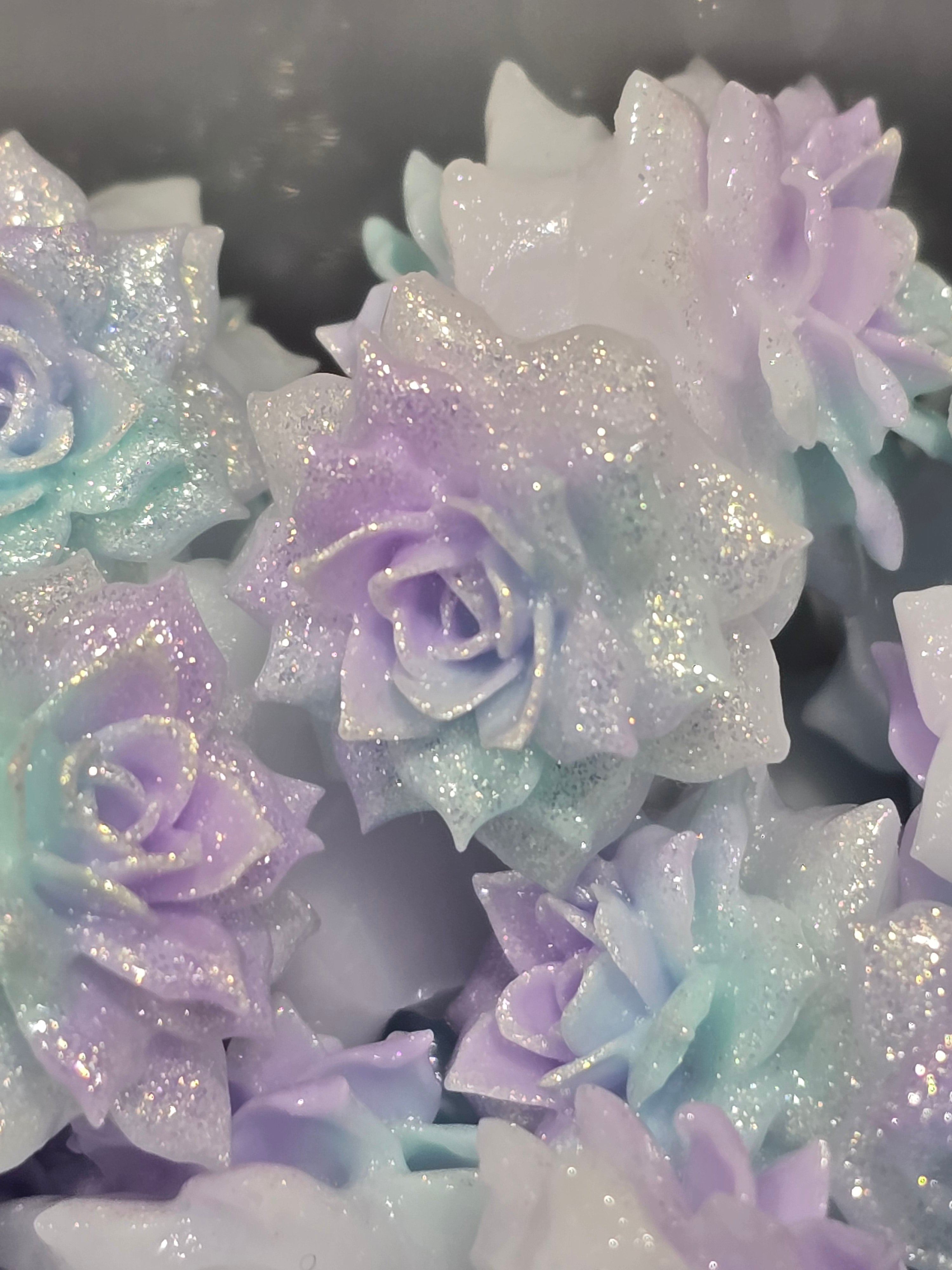 Soft flowers in pastel lavender, lilac, and icy blue tones.