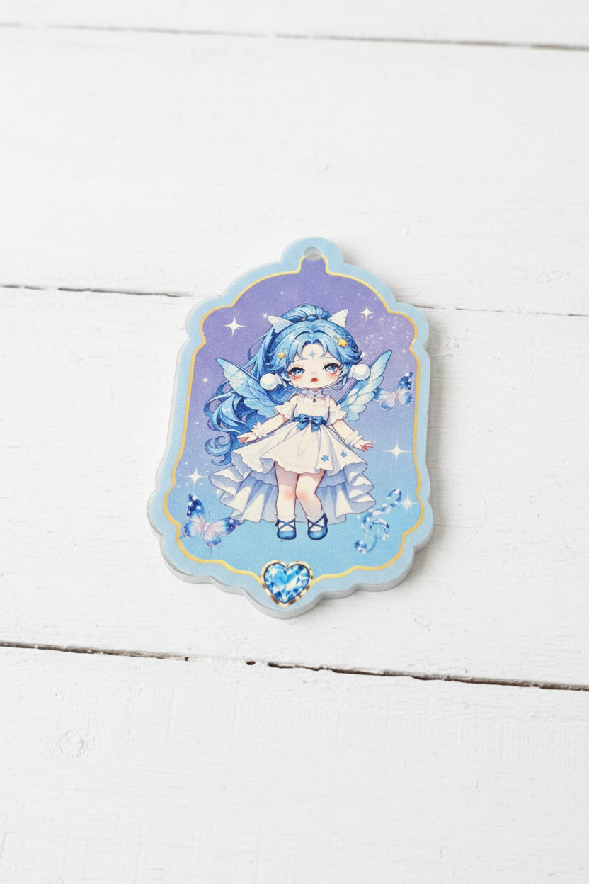 An acrylic tag featuring an anime-style illustration of a blue-haired girl in a white dress on a purple starry background.