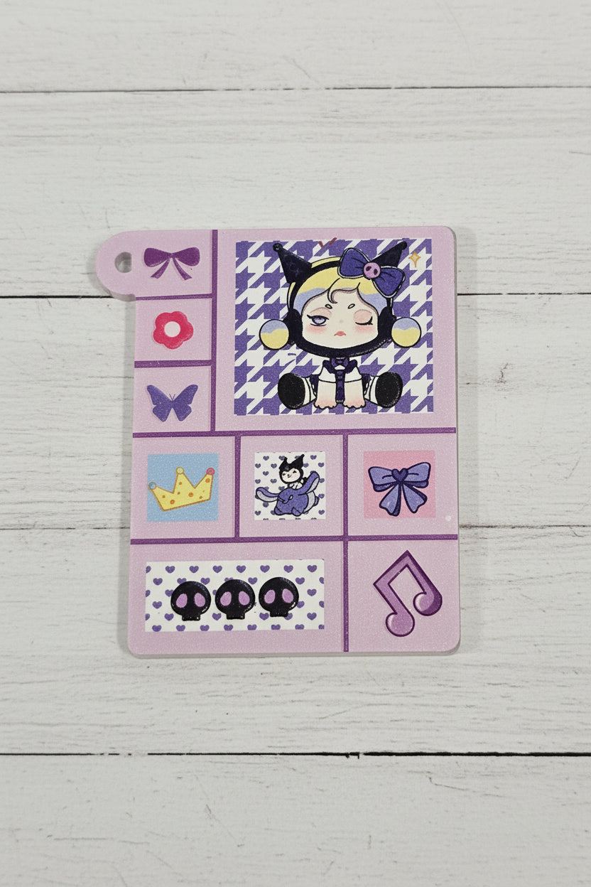 A square acrylic tag. The tag features a purple-and-white houndstooth pattern, a character illustration, bows, a flower, a crown, and other small decorative icons.