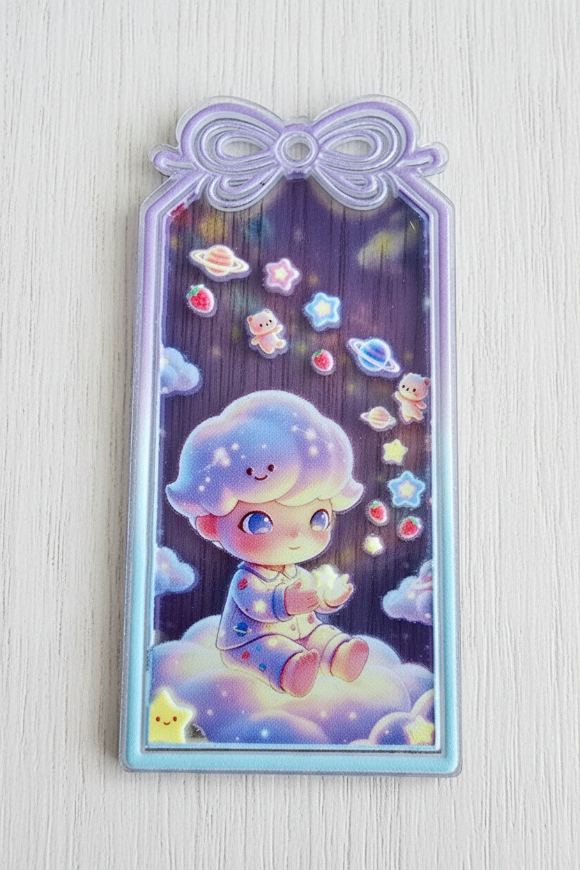 A rectangular acrylic tag with a pastel illustration of a cute character floating among stars and clouds.
