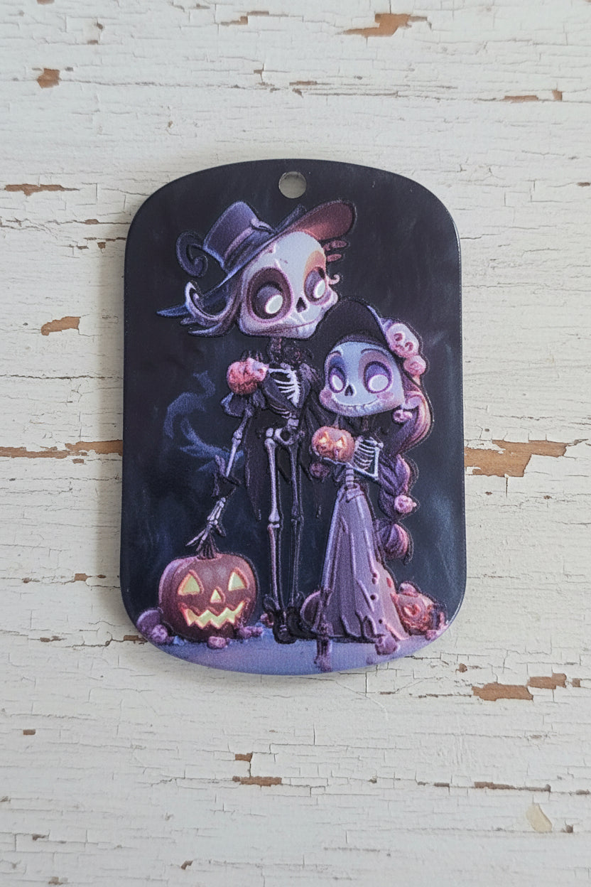 A rectangular acrylic tag with rounded corners featuring a colorful Day of the Dead (Calavera) and Sally the skeleton illustration.