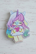 An acrylic bead featuring a cute pastel unicorn girl character with pink hair, a purple horn, and a pink heart