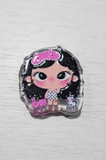 A small decorative bead featuring a cartoon girl with black hair, a pink bow, and a polka-dot dress