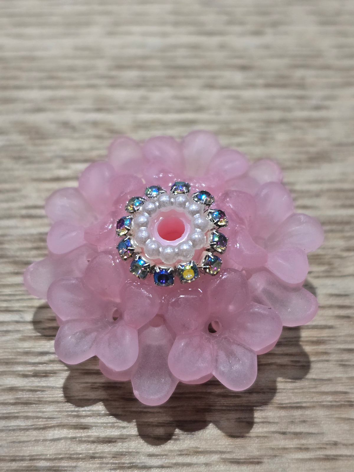 light pink flower fancy bead with a rhinestone edging