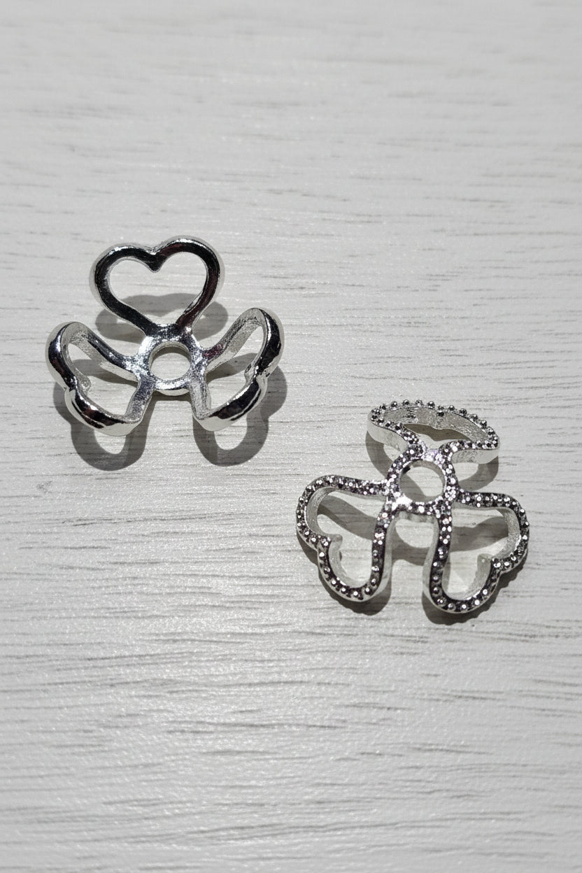 Silver heart-shaped bead caps.