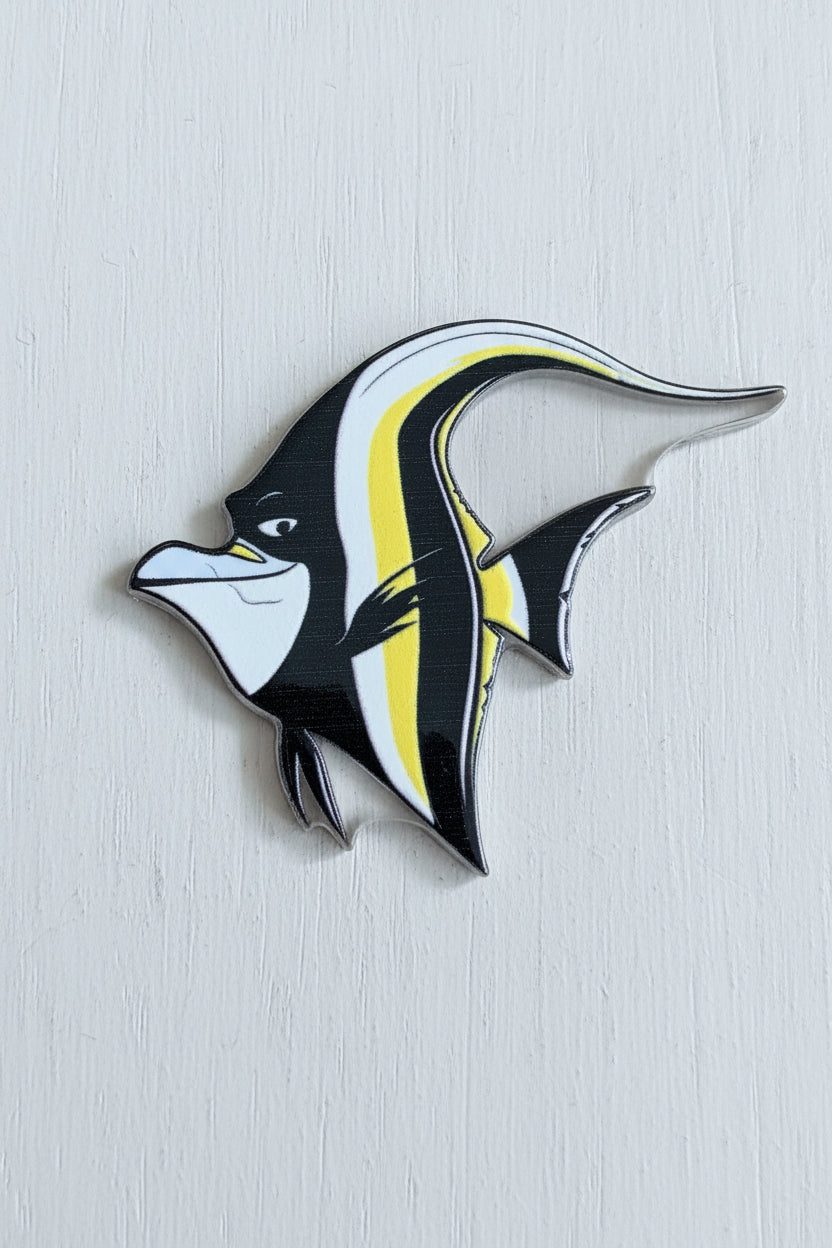 A stylized fish-shaped acrylic tag with black, white, and yellow colouring.