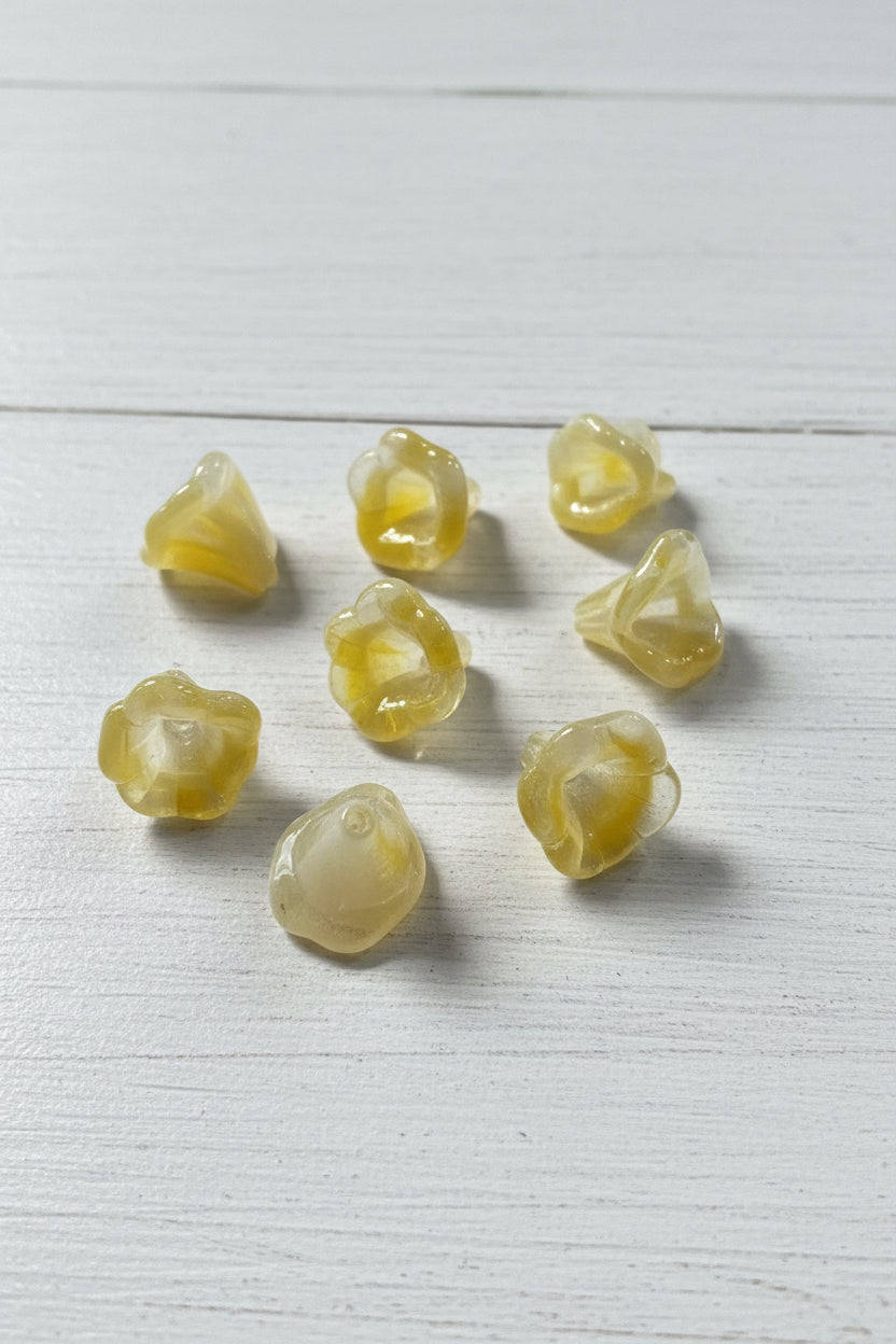 Glass flowers - yellow and white-coloured beads .