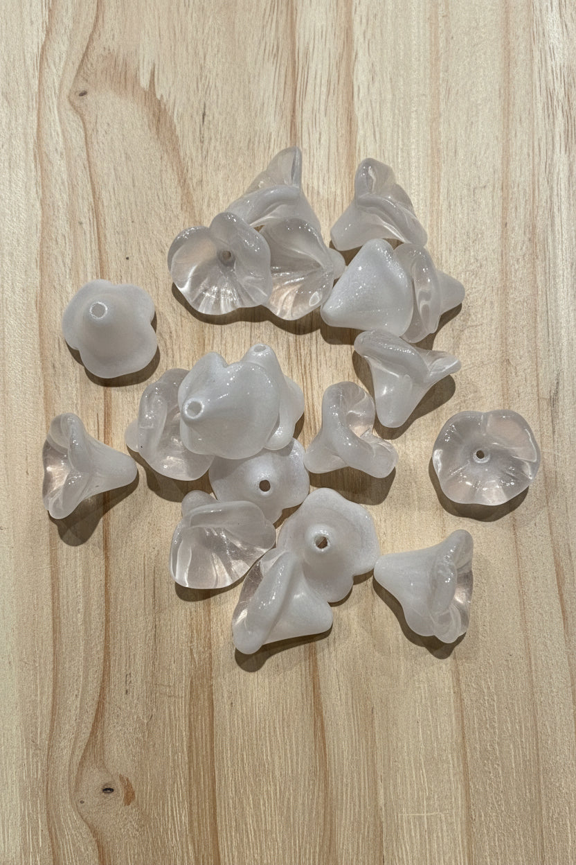  several small, translucent white glass flower beads.