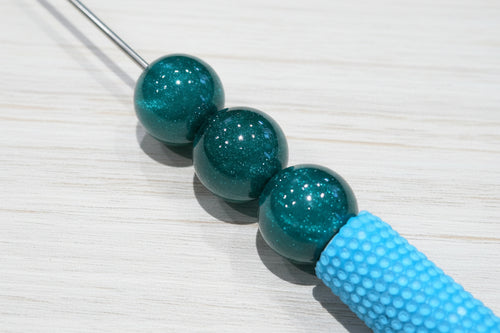 Glossy resin beads.