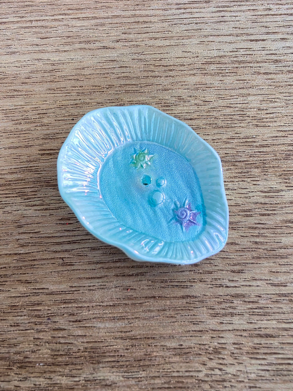 A fish pond with a scalloped rim.