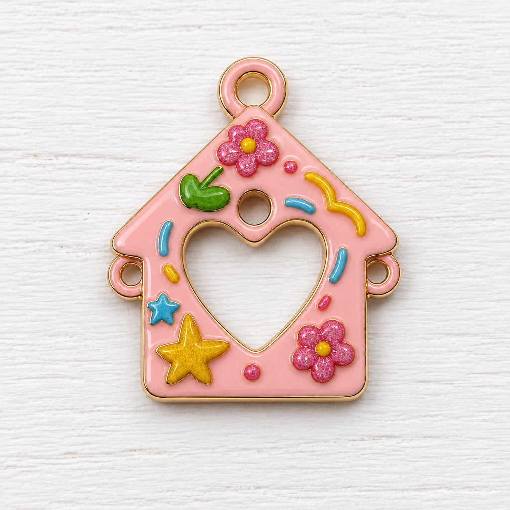 A pink metal house-shaped charm with a heart cut out in the centre, decorated with colourful raised flowers, stars, and curved accents