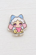 A small metal bead featuring a cute anime-style character with white hair, blue cat ears, pink cheeks, and a pink heart.