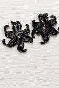 Black acrylic flowers with drooping petals
