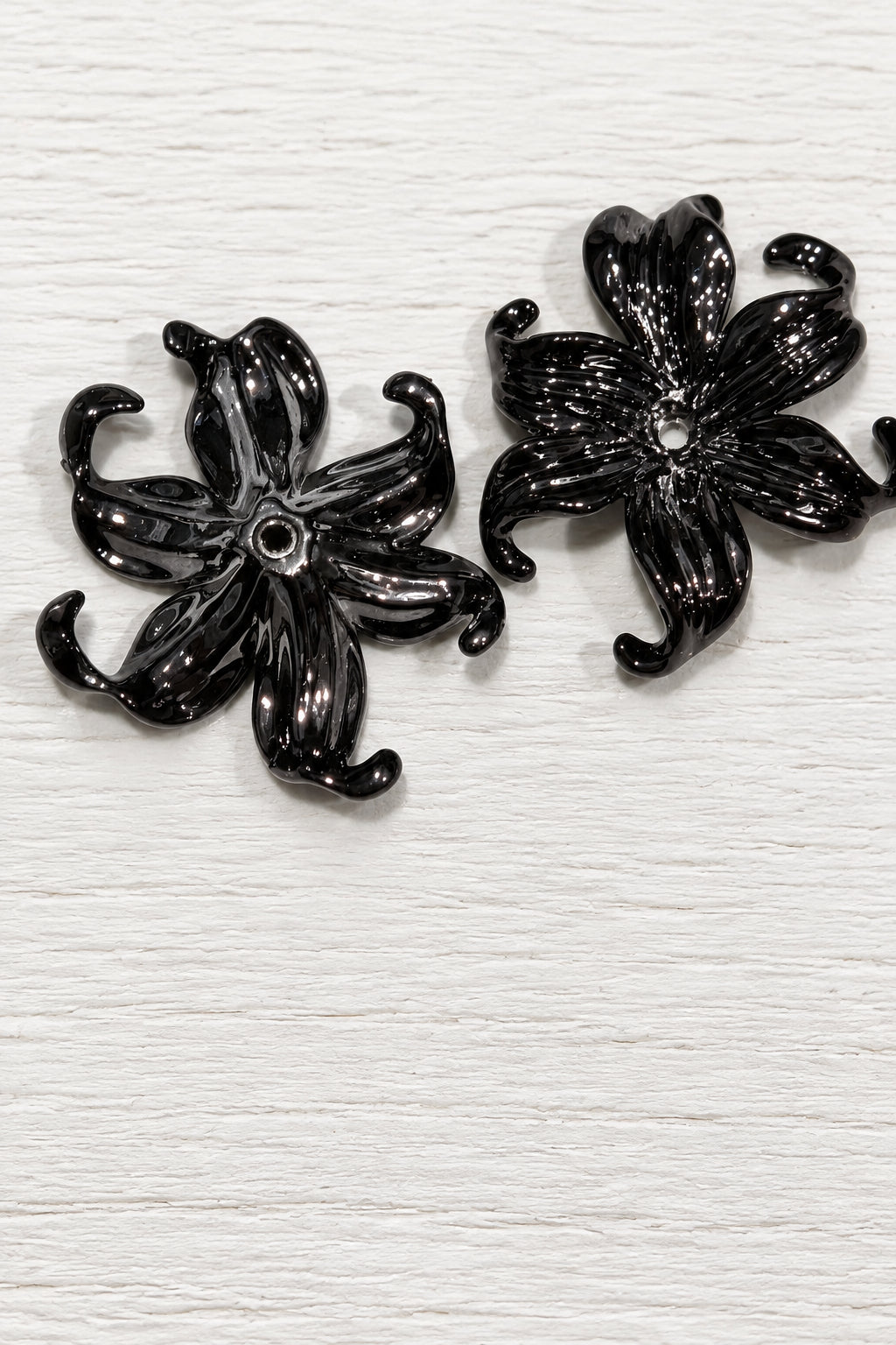 Black acrylic flowers with drooping petals