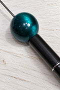 25mm resin bead in a dark blue colour