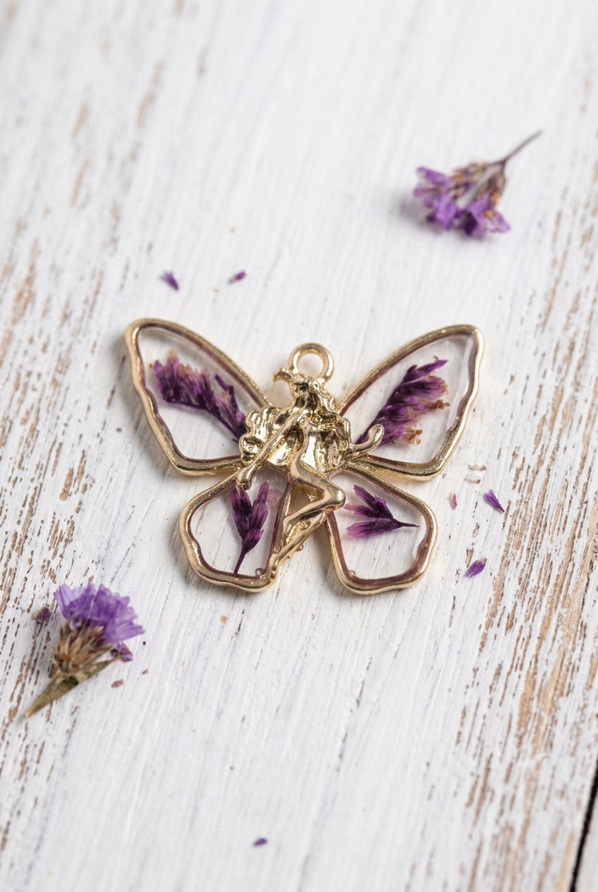 butterfly charm with dried flower and fairy detail